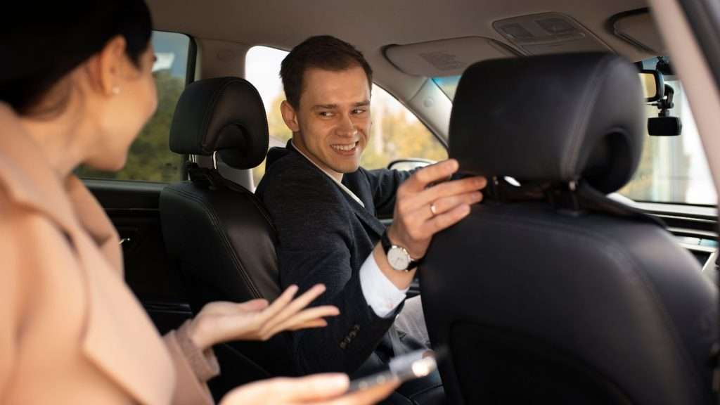 A driver talks with a passenger about the Red Hot Chili Peppers 2019 concert