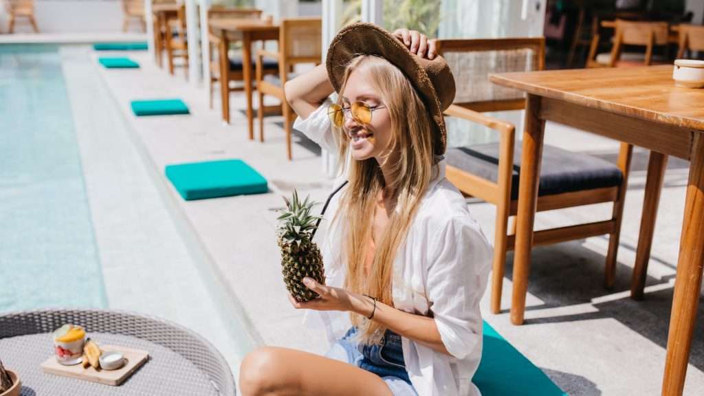 Woman enjoying breakfast at a Broadbeach restaurant.