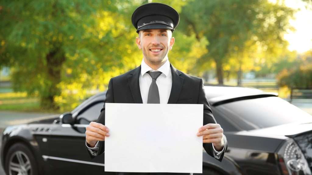 Jayride car driver with nametag at airport.