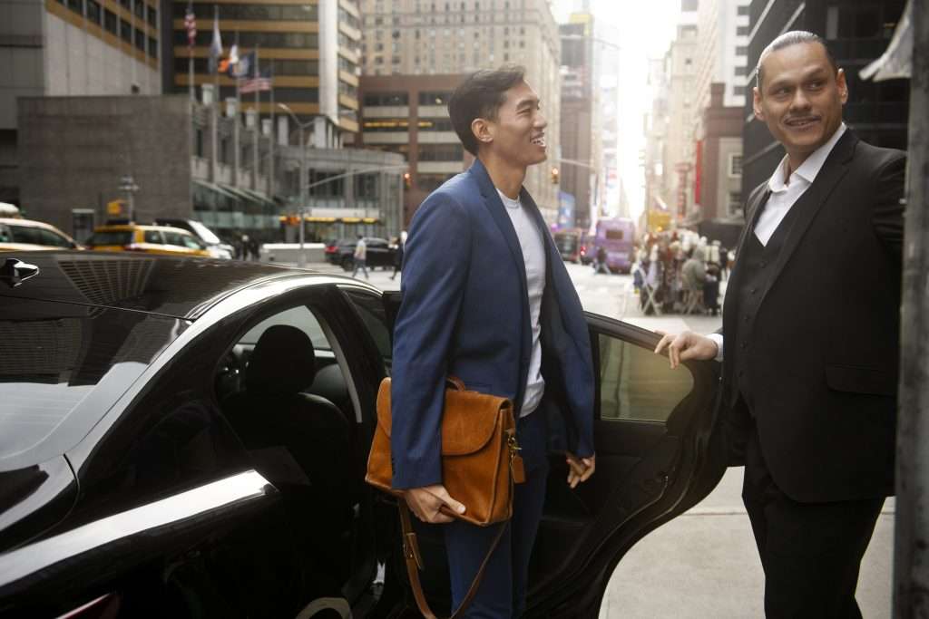 Conference Transfers Vip and Speakers arrive smiling downtown