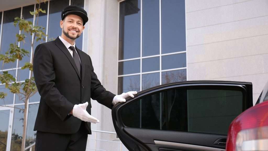 black luxury vehicle with a professional chauffeur