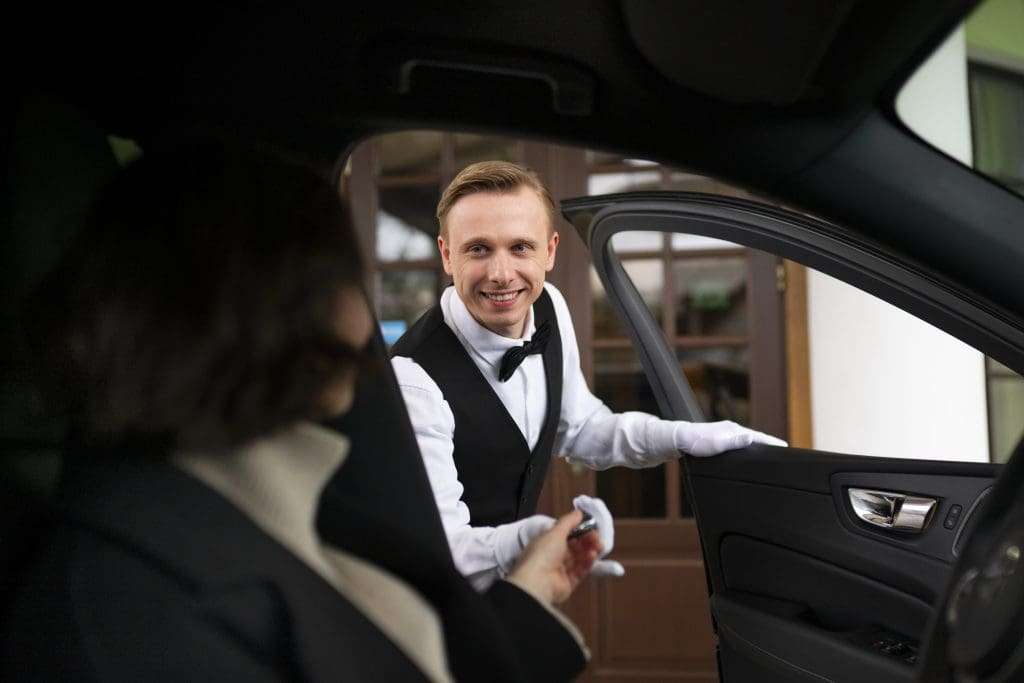 Hilton Surfers Paradise Butler assisting woman at Hilton Surfers Paradise.