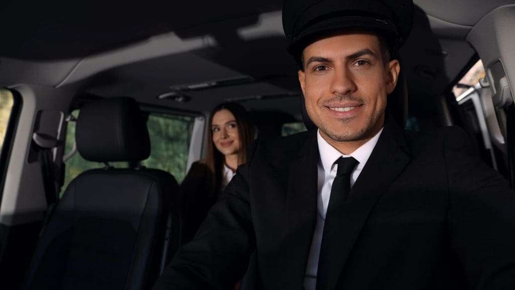 Private Driver and lady sitting back.