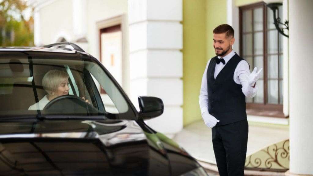 Luxury Melbourne hotel driver assists woman.