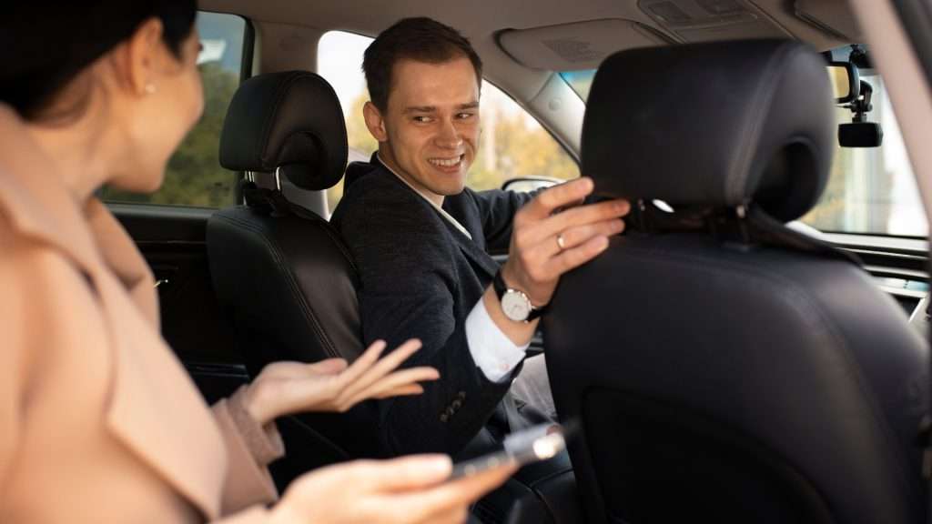 professional chauffeur having a chat with lady