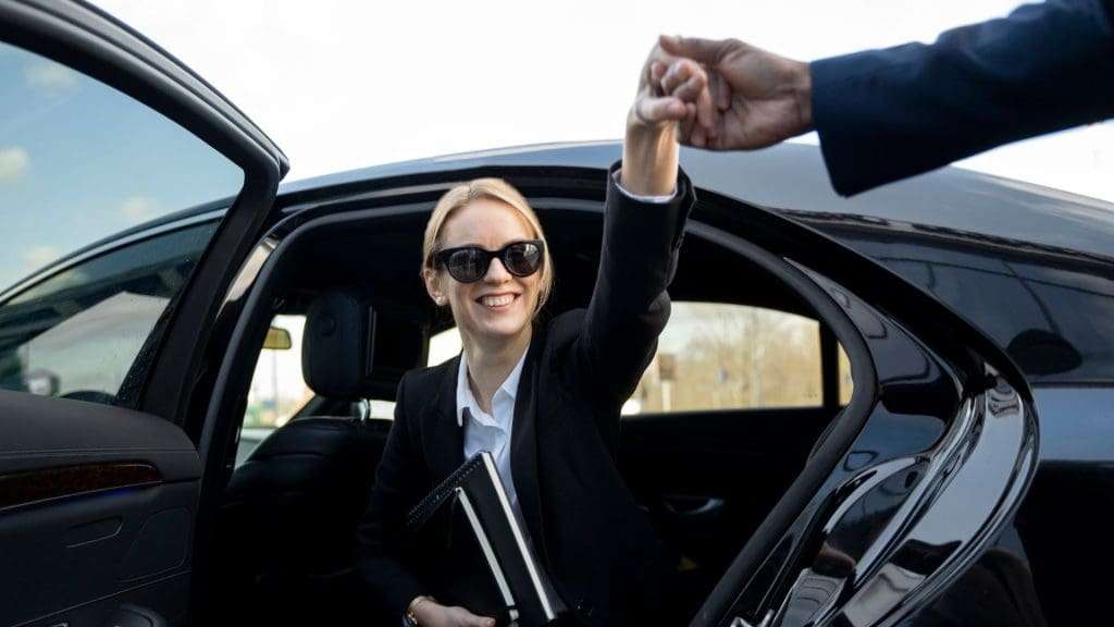 Discovering the Gold Coast: Woman with a smile stepping out of car at Gold Coast.