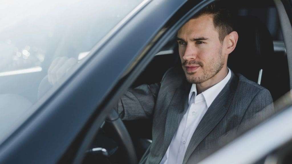 Corporate Chauffeur Service with driver in suit